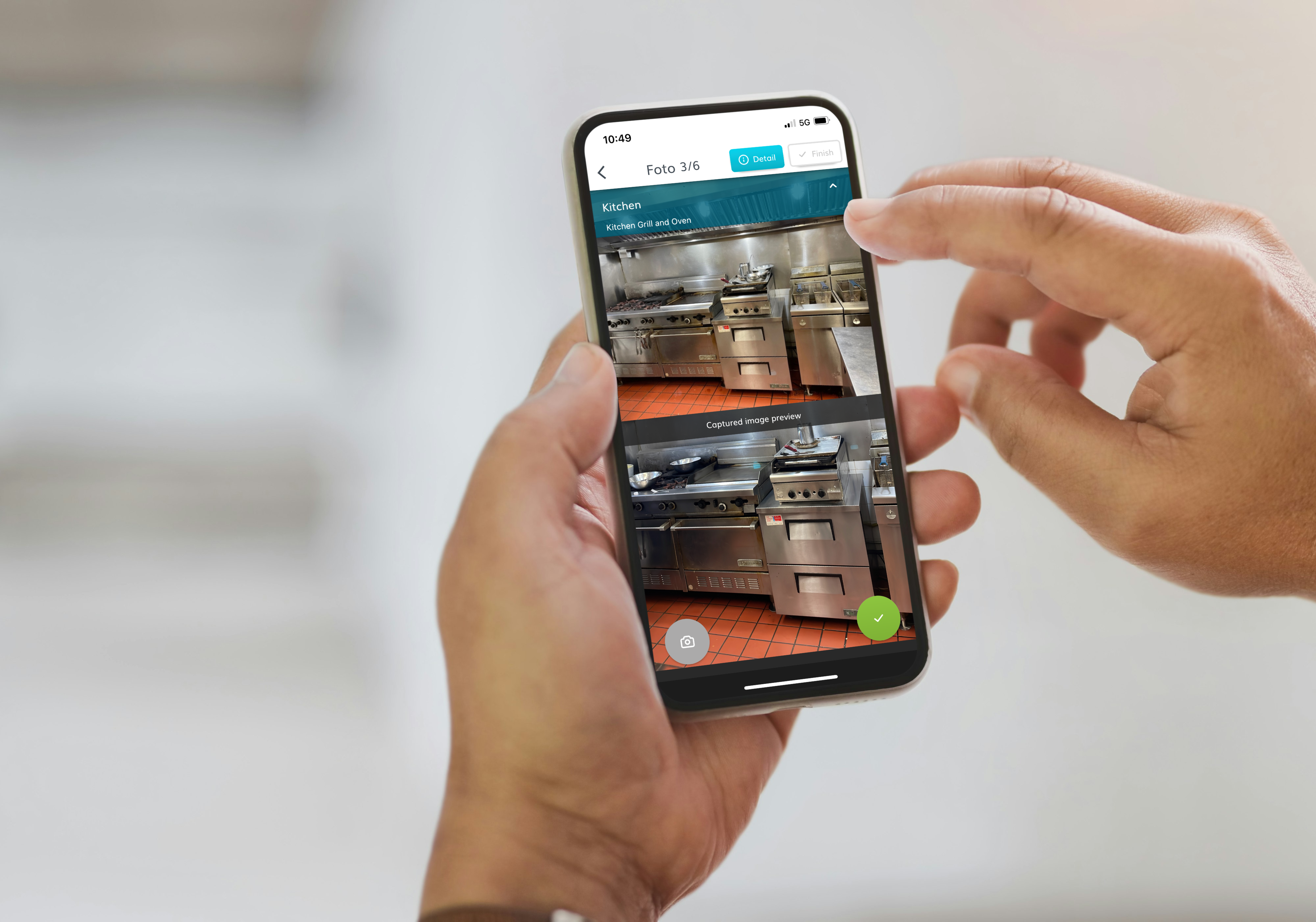 Cleaning manager reviewing FotoFinish photo reports on a tablet